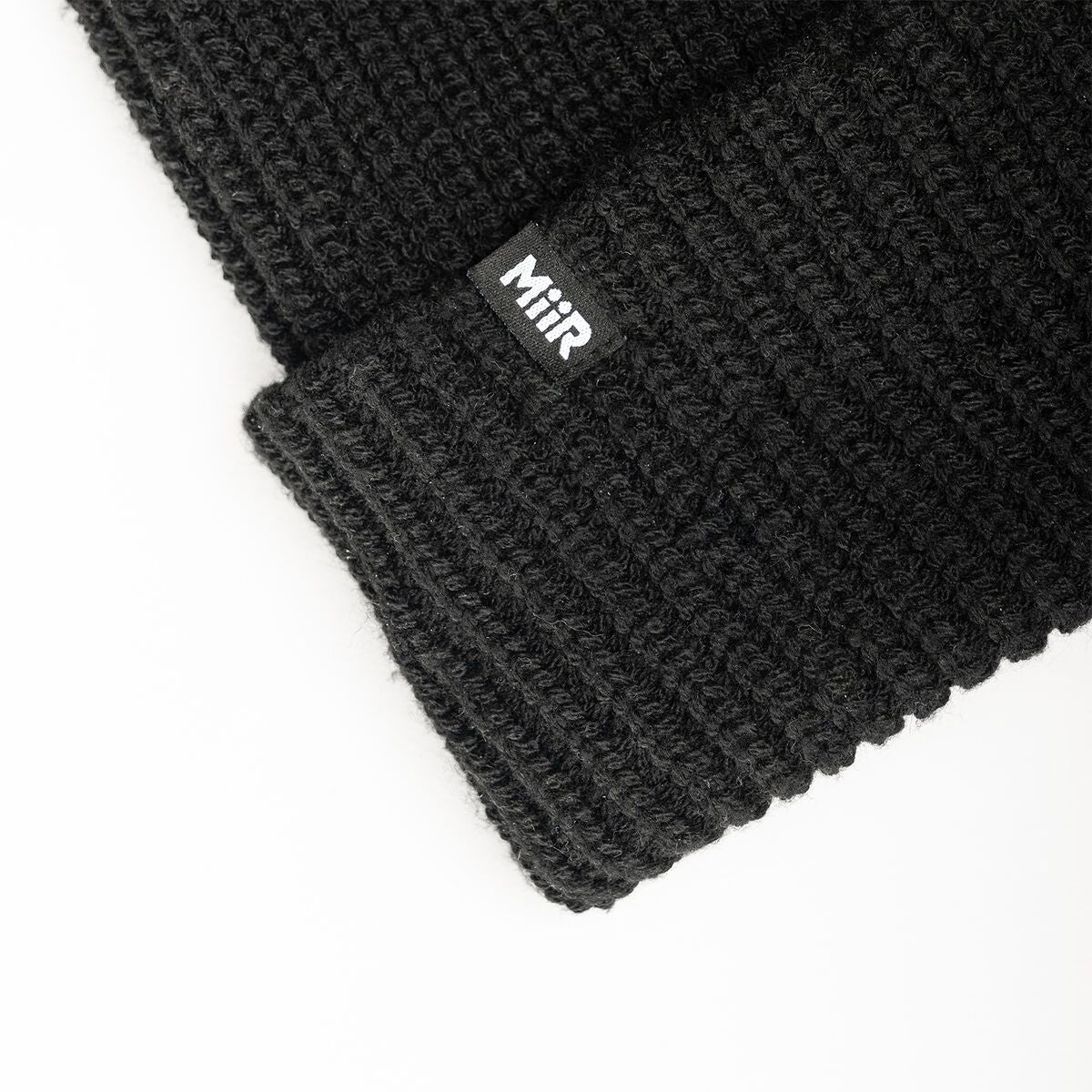 recycled-poly-rib-beanie-l1 WebPDP-RecycledPolyRibBeanie_Studio_TagDetail_Black__BNE002002OS.jpg